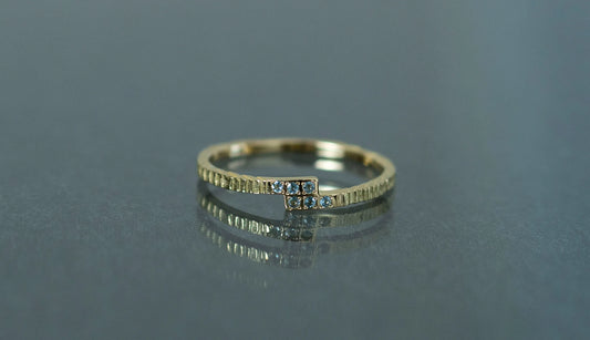 Unknown knowns line ring + blue topaz