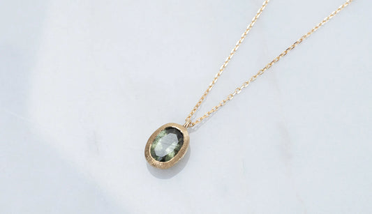 Ludwigite in peridot necklace